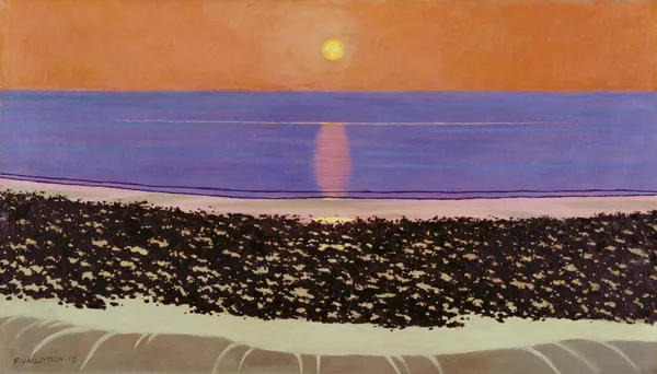 A low sun over the sea, the sky in bands of gold and rose