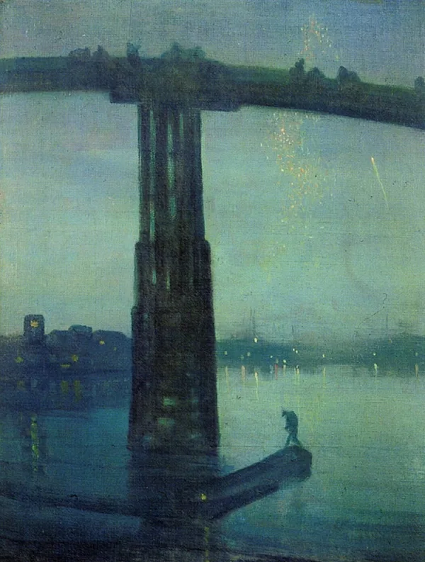 A bridge at dusk over the Thames in blue and gold